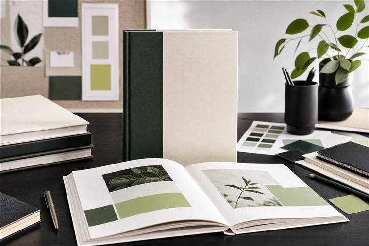 Professional book presentation workspace with book mockup and layout materials